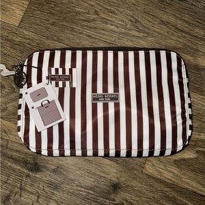 Henri Bendel zip around packable backpack. Signature brown and white stripes
